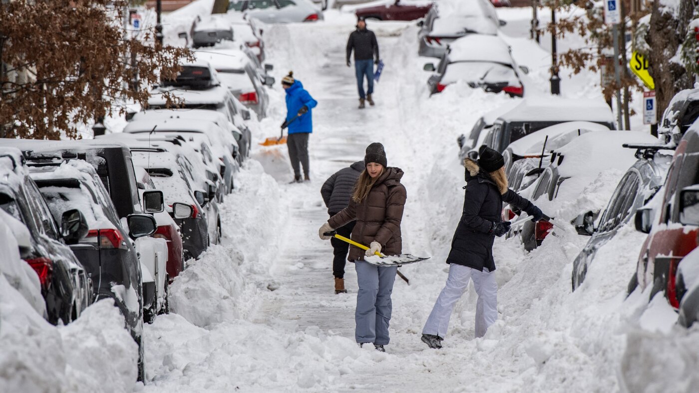 The debate over saving a public parking spot after a snowstorm : NPR