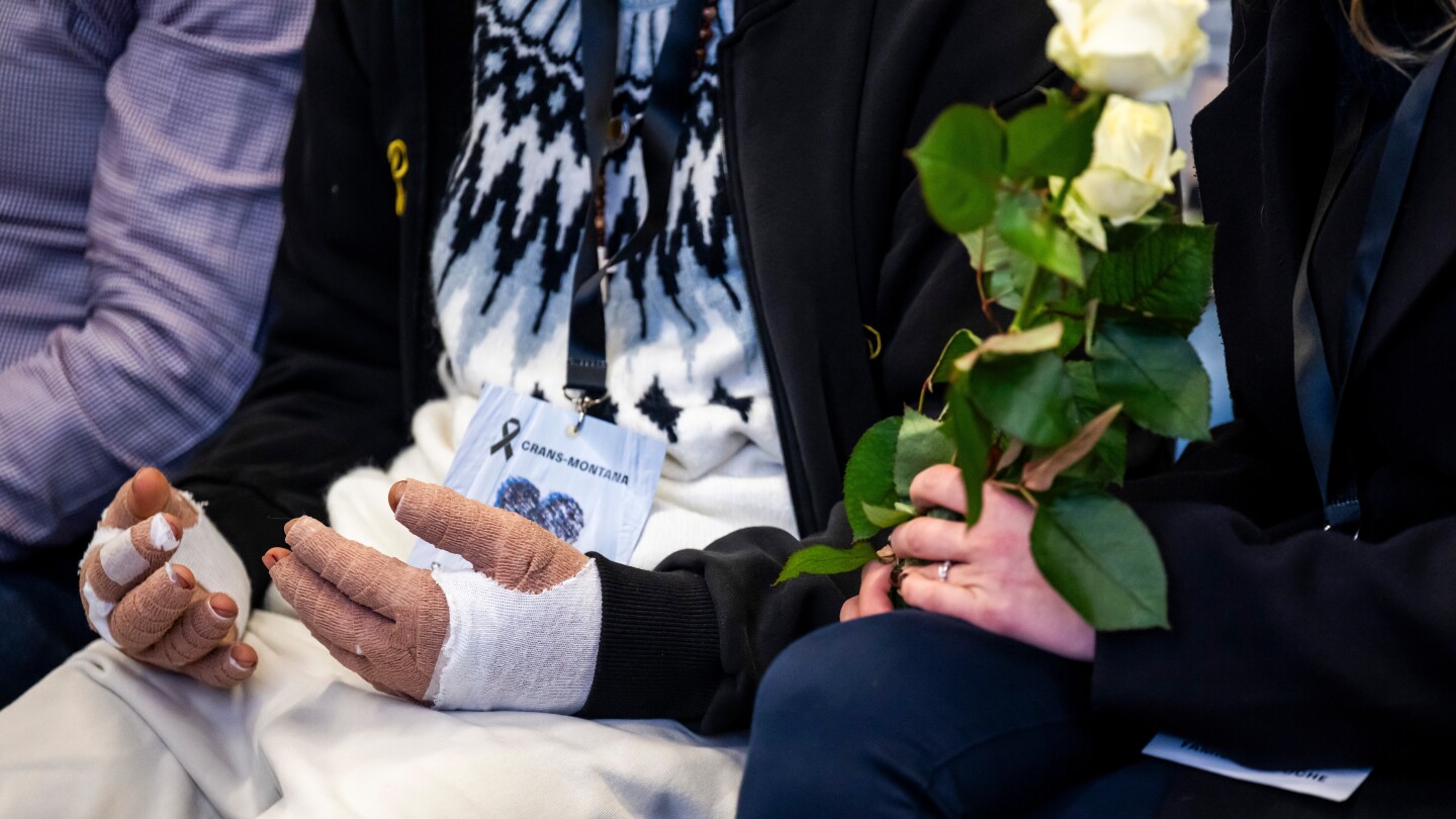 Swiss bar owner held in custody over resort fire on national day of mourning for the victims