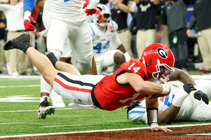 Gunner Stockton (14) scores a touchdown against the Mississippi Rebels in the second quarter during the 2025 Sugar Bowl.