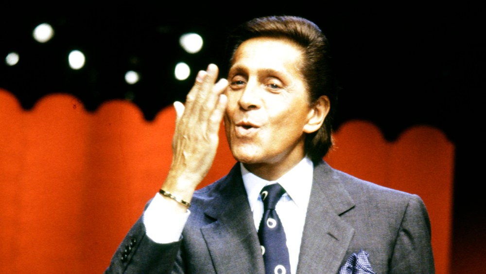 Valentino Garavani greets the audience at the finale of the Valentino Fall 1993 Couture Runway Show on July 21, 1993, in Paris, France.