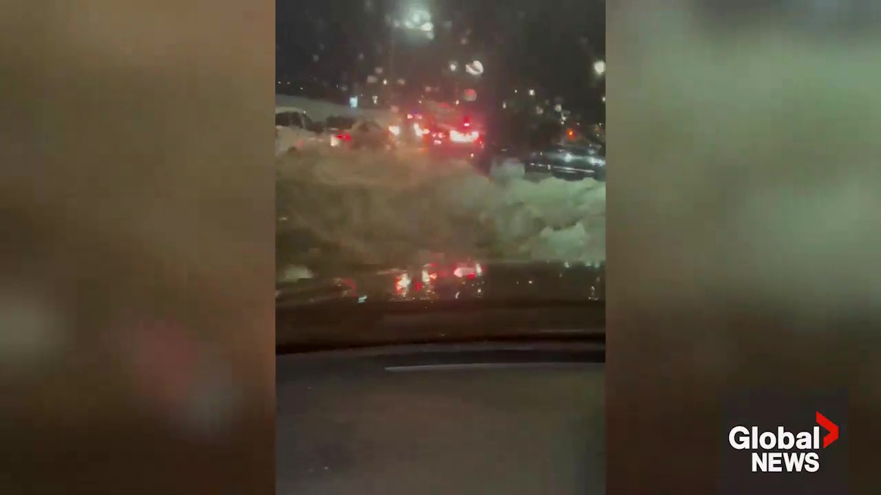 Click to play video: 'Driver escapes water main break flood on Trans-Canada Highway in Calgary'