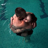 Sgt. Mykhailo (Misha) Varvarych, 28, and his fiance, Iryna (Ira) Botvynska, 19, take part in a therapeutic swimming activity at Moldova pool in Truskavets, Ukraine.