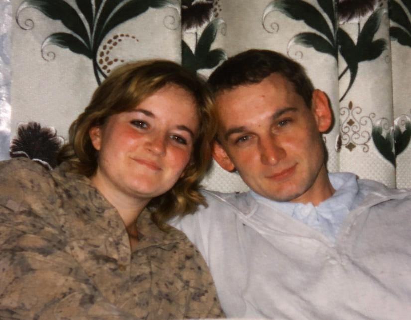 Young Valerii and Valentina Klochkov, a couple, smiling at the camera.