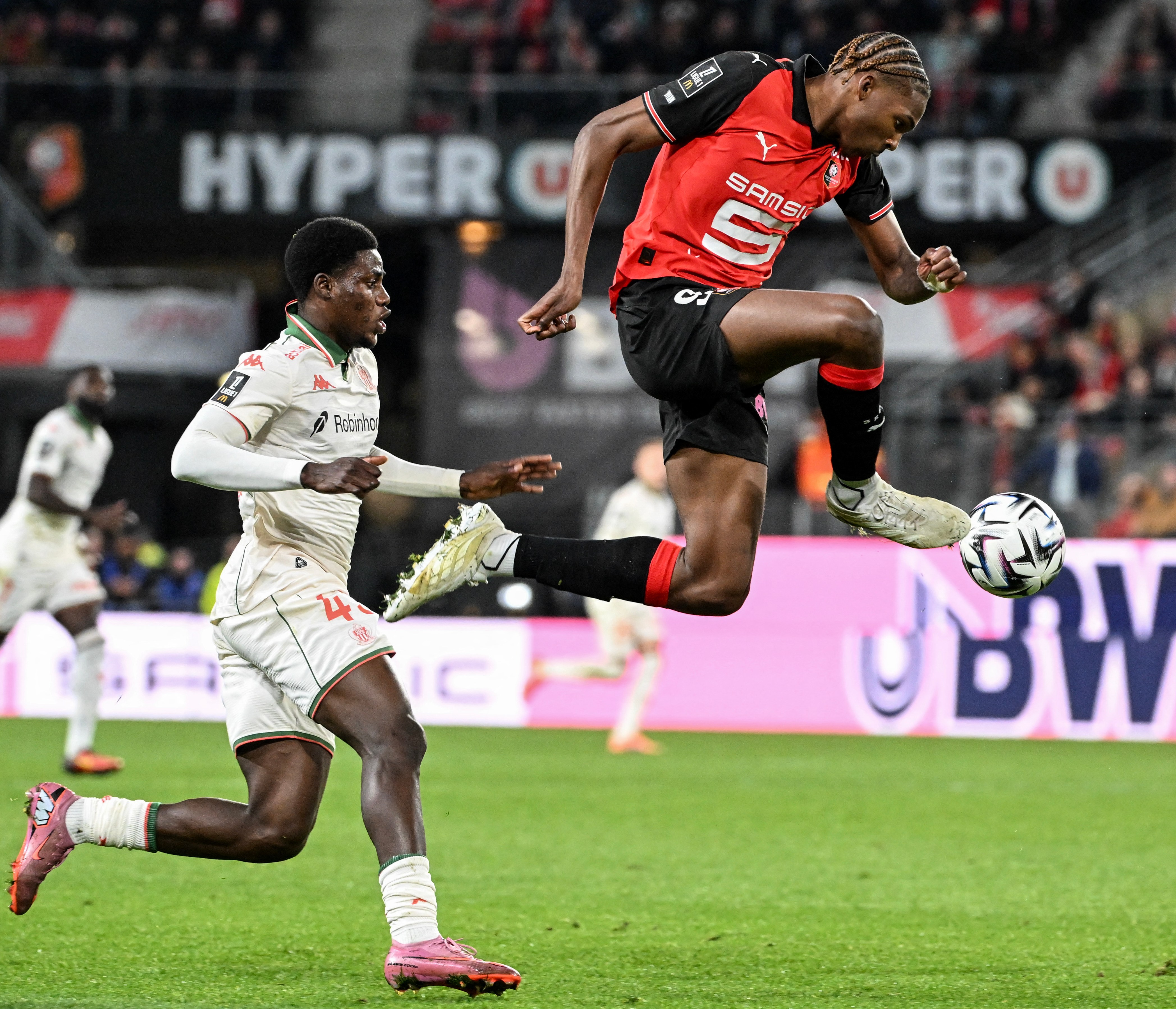 Nice's Bernard Nguene and Rennes' Jeremy Jacquet fighting for the ball during a French L1 football match.