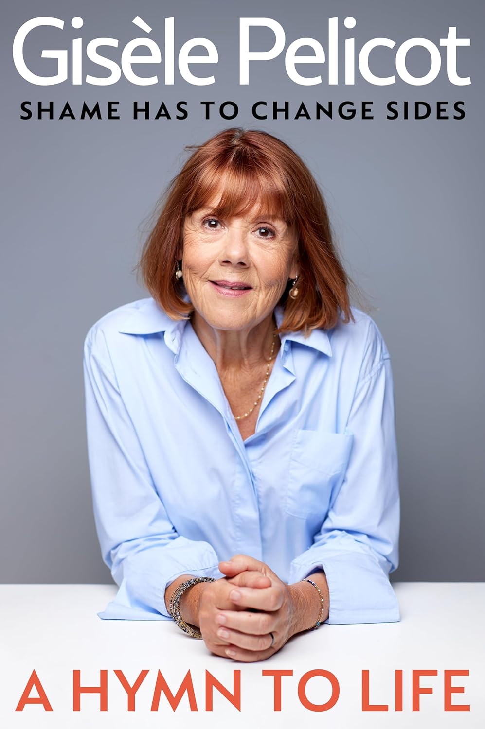 Book cover for "A Hymn to Life: Shame Has to Change Sides" by Gisèle Pelicot, featuring a smiling Gisèle Pelicot.