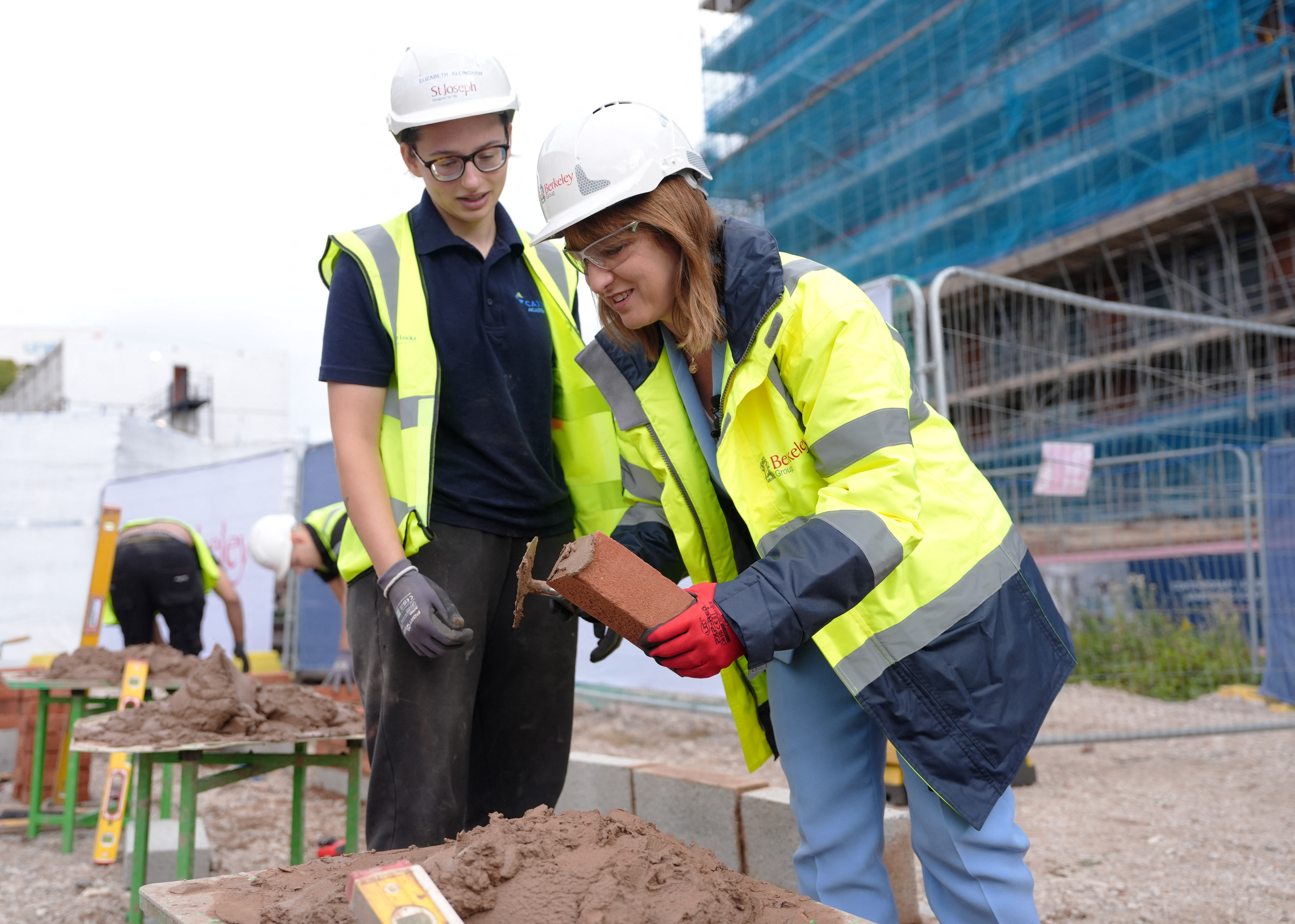 Rachel Reeves and Elizabeth Allingham bricklaying at the Glasswater Locks Development.