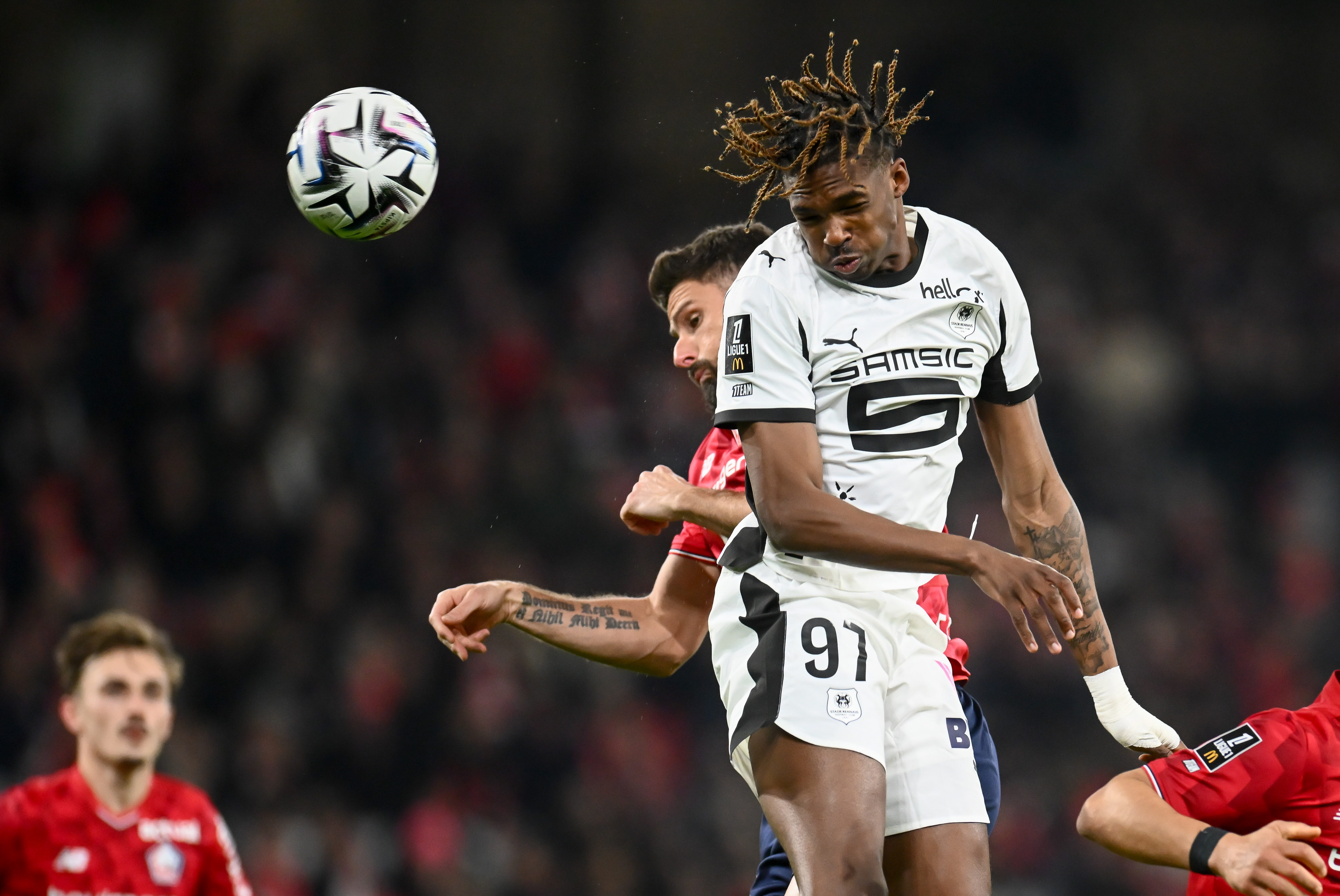 Jérémy Jacquet of Stade Rennais and Olivier Giroud of LOSC competing for a header during a Ligue 1 McDonald's match.