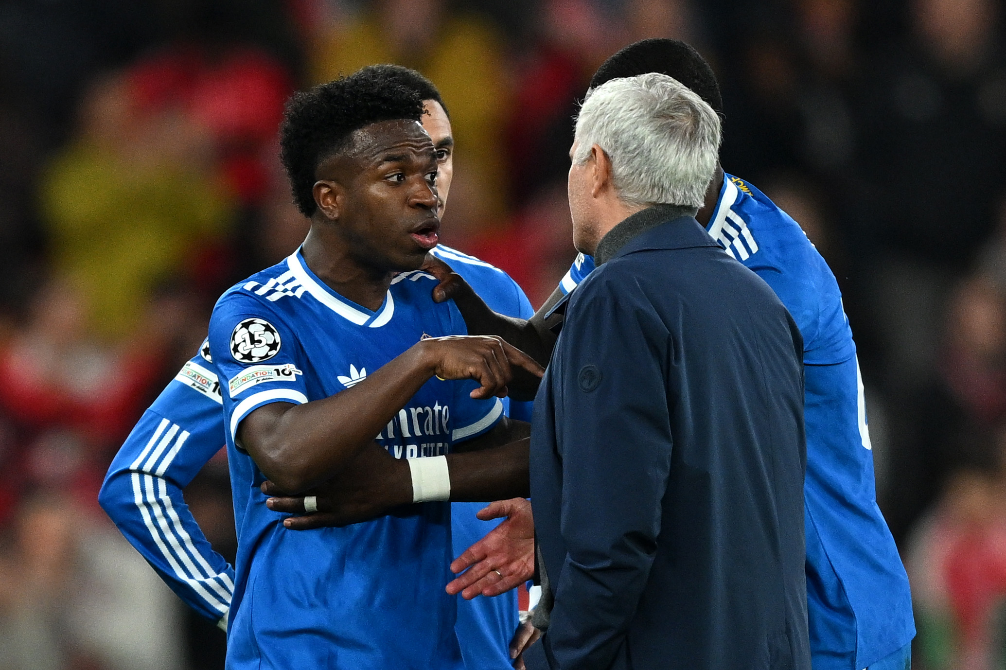 Vinicius Junior of Real Madrid speaking with Benfica Head Coach Jose Mourinho.