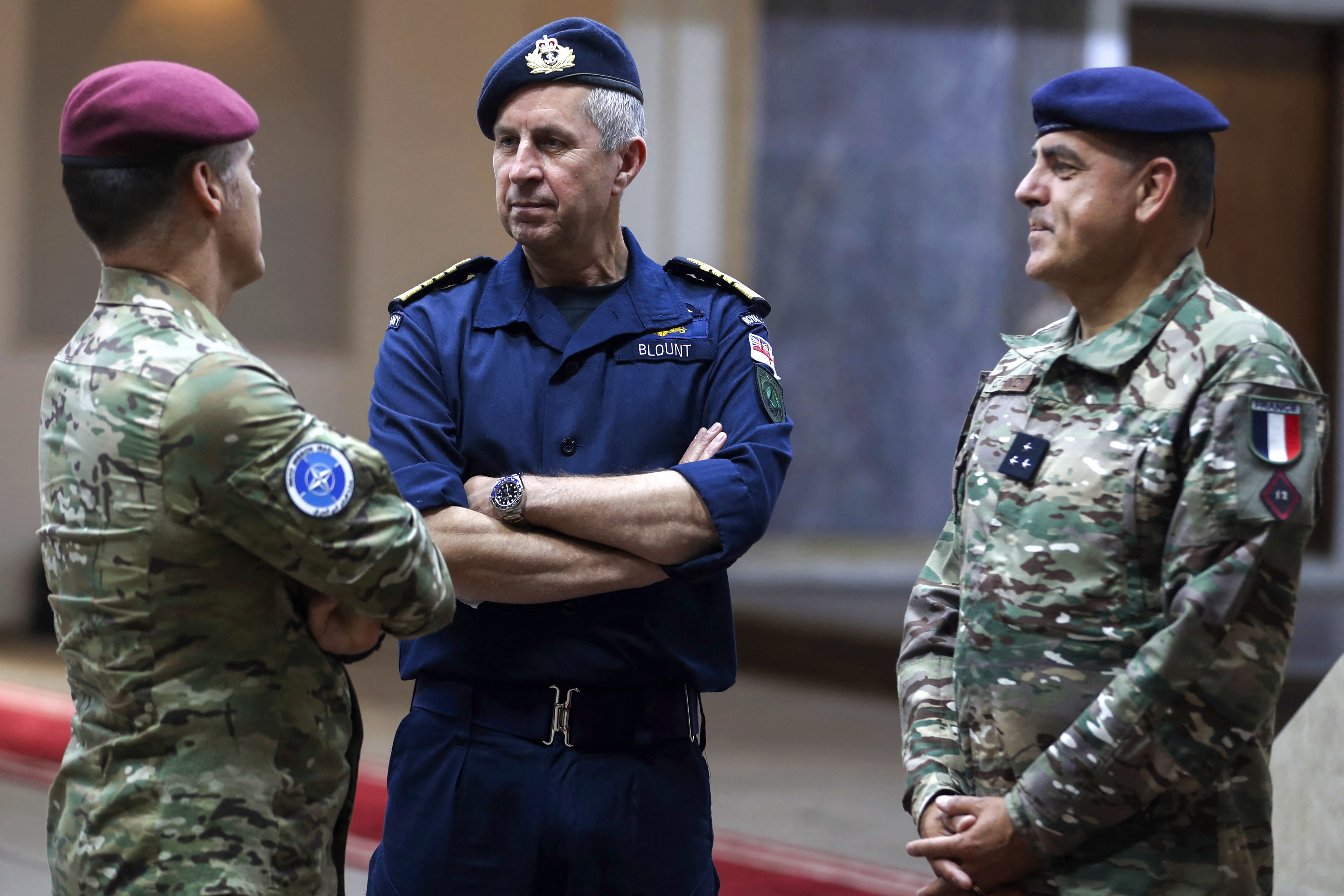 NATO's Deputy Supreme Allied Commander for Europe, Admiral Sir Keith Edward Blount, speaking with the outgoing Dutch NATO Iraq mission commander, Lieutenant General Lucas Schreurs, and his successor, French Major General Christophe Hintzy.