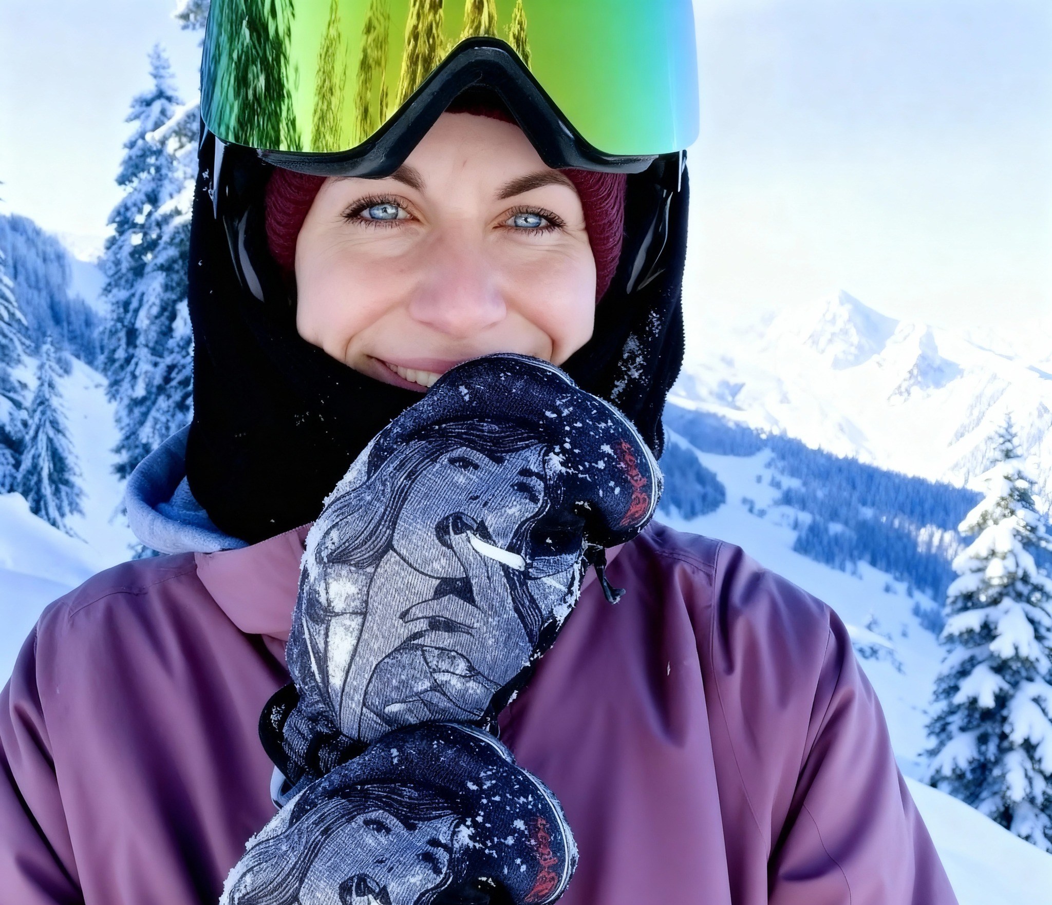 Kerstin Gurtner smiling in ski gear, with snow-covered mountains in the background.
