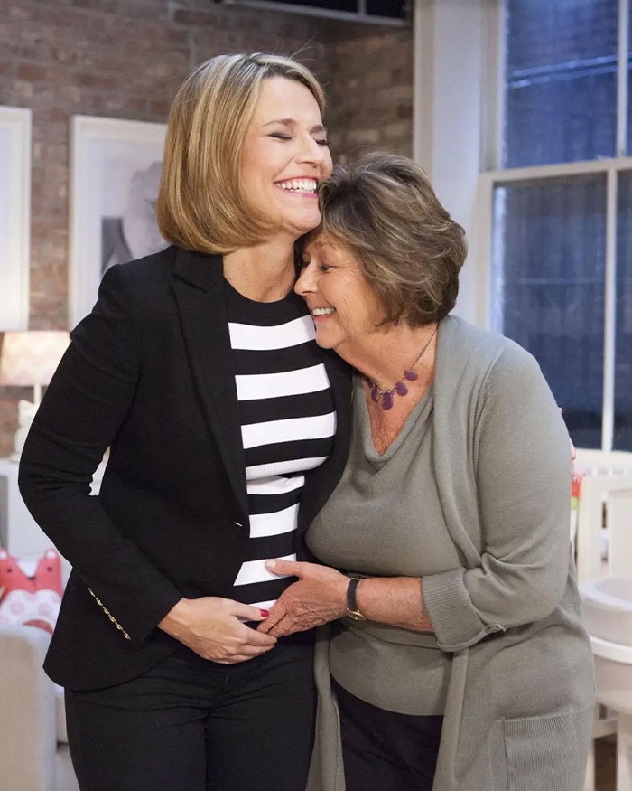 Two women smiling and embracing in a cozy room, highlighting Nancy Guthrie's disappearance and an FBI official update. Two women smiling and embracing in a cozy room, highlighting Nancy Guthrie's disappearance and an FBI official update.