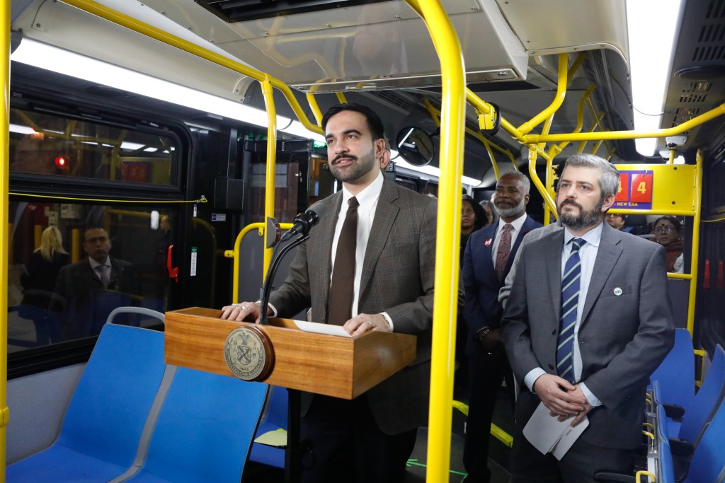Mayor Zohran Mamdani speaks inside an MTA bus at the West depot in the Bronx about providing free service