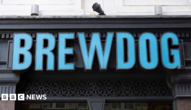 A blue sign which says Brewdog on a building.