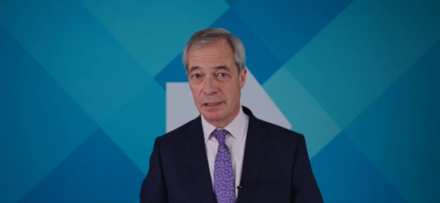 Reform UK leader Nigel Farage in a blue suit and lilac-coloured tie
