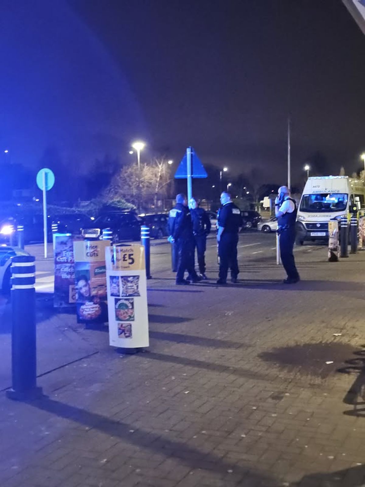 Police outside Morrisons on Besford Road, Belle Vale