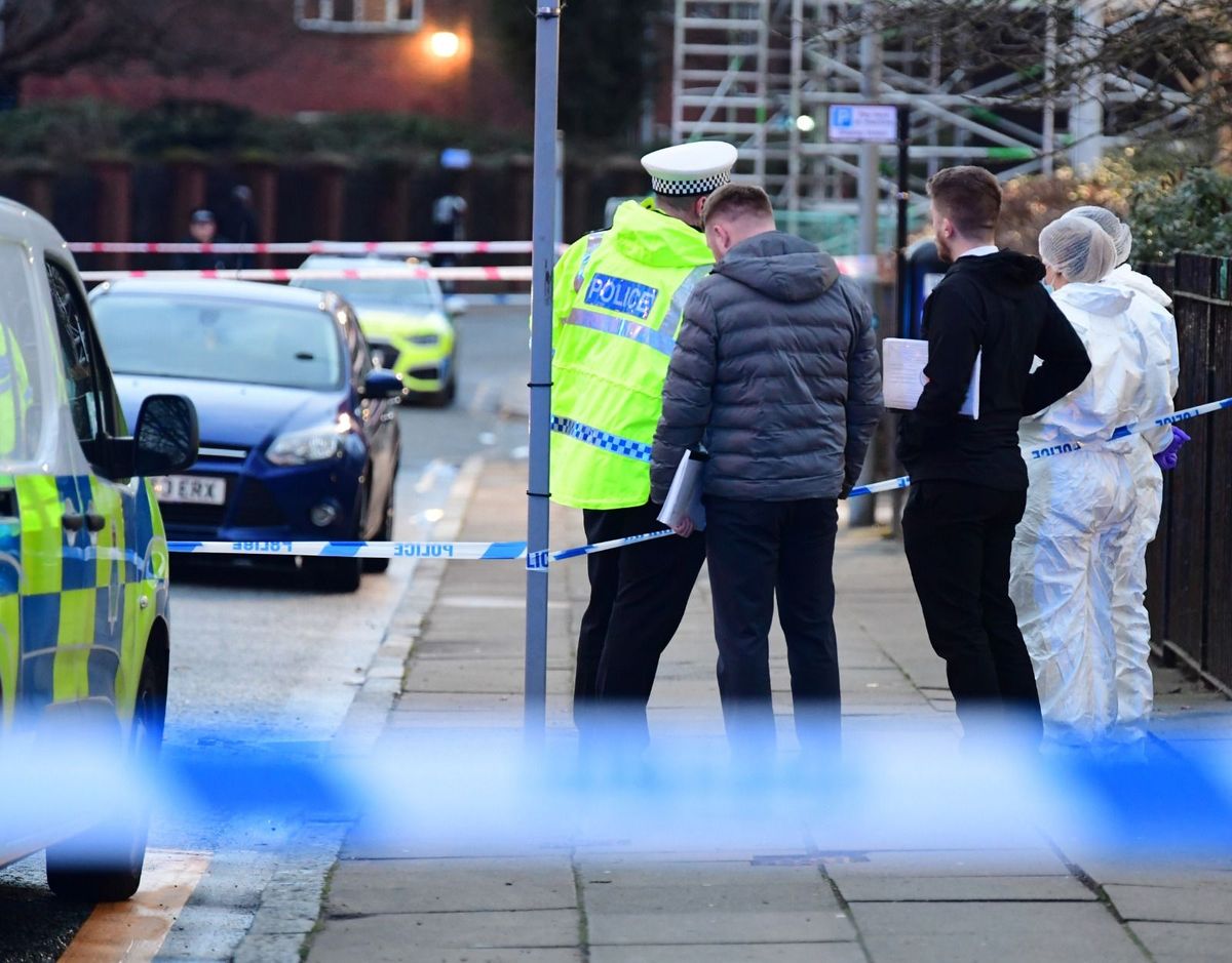Police and forensic officers at the scene after a man came off his bike as officers attempted to stop him