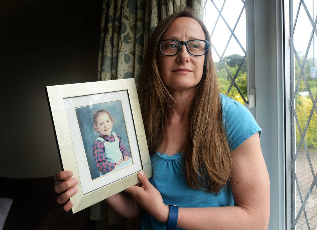 Julie Ryan with a picture of her daughter, Heather Preen.