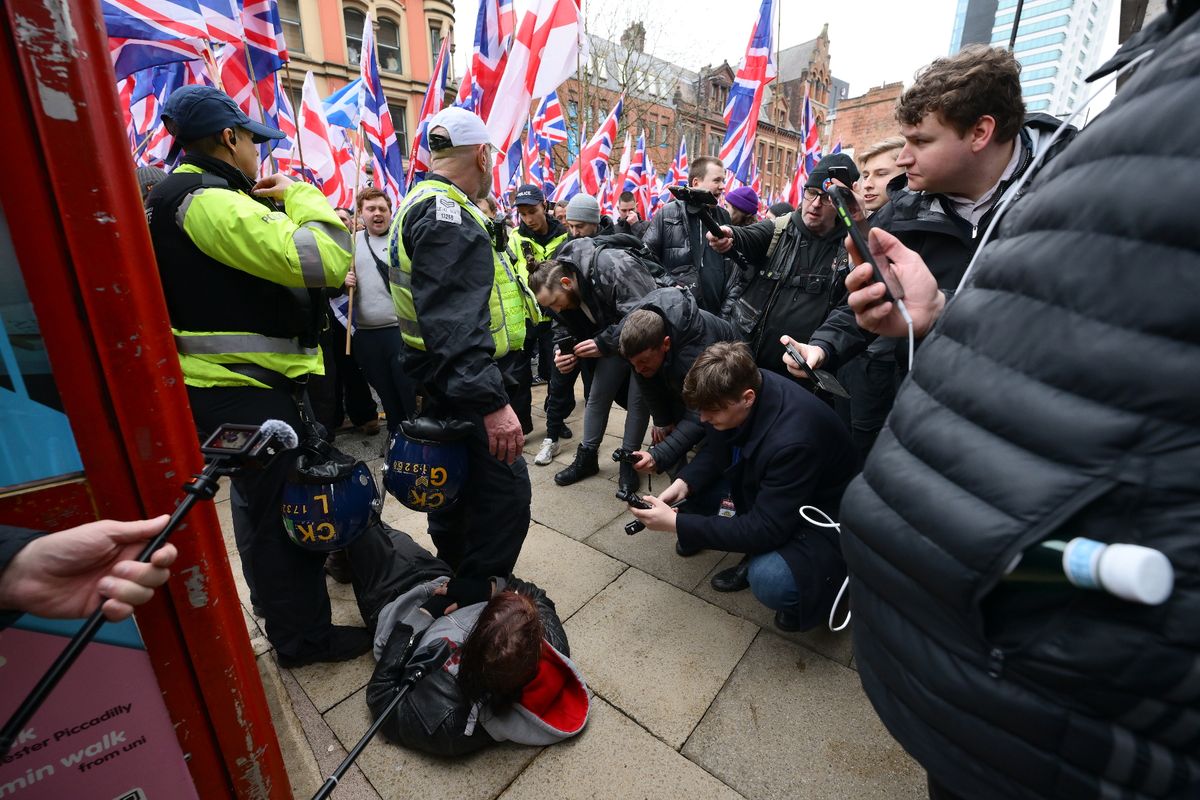 Protesters and police in Manchester city centre