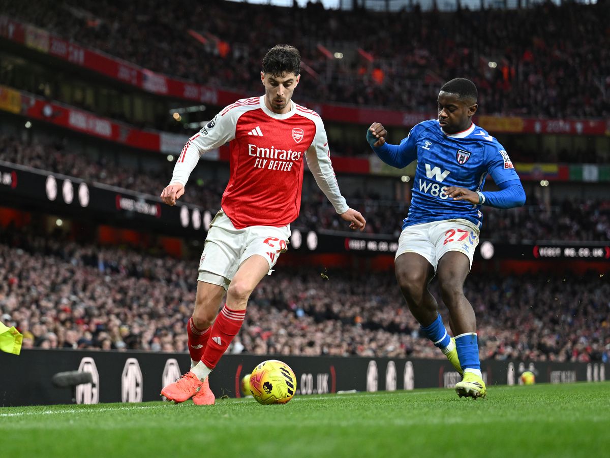 Kai Havertz of Arsenal is closed down by Noah Sadiki of Sunderland during the Premier League match between Arsenal and Sunderland at Emirates Stadium on February 07, 2026 in London, England