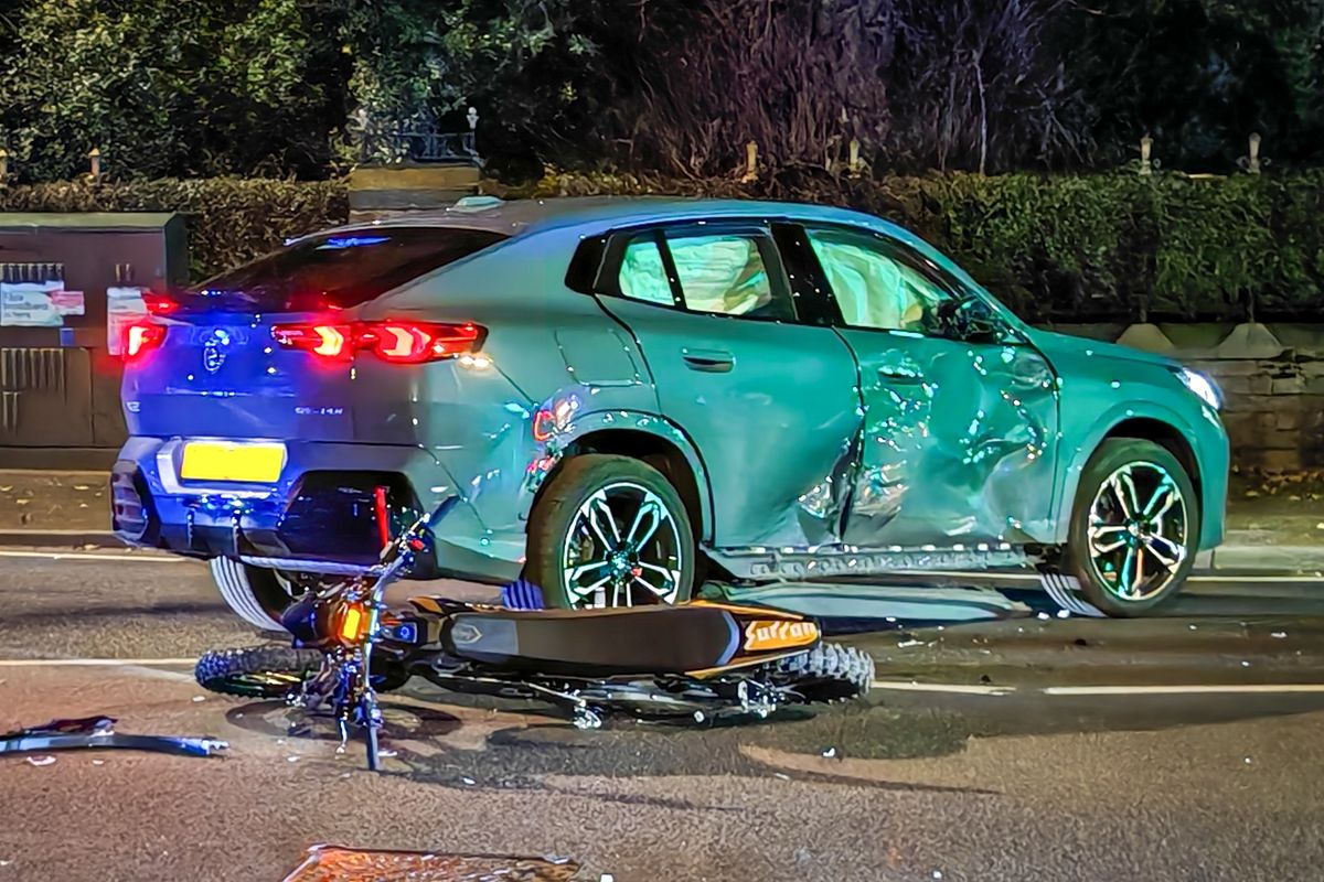 A green BMW and a Surron e-bike were involved in the crash on Barlow Moor Road