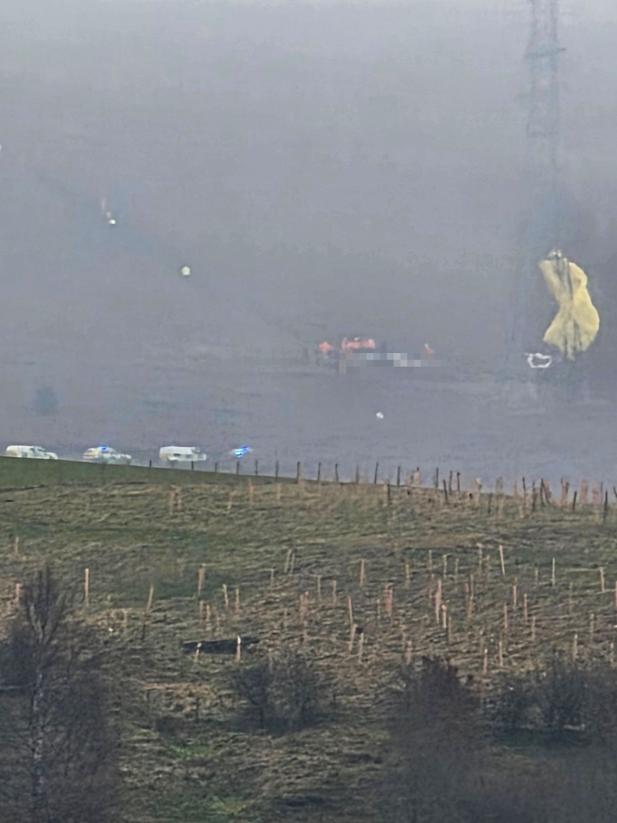 Fire crews attend to the crashed aircraft 