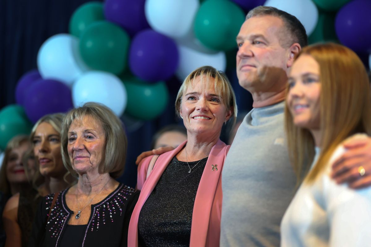 Sandie Peggie stands with her family