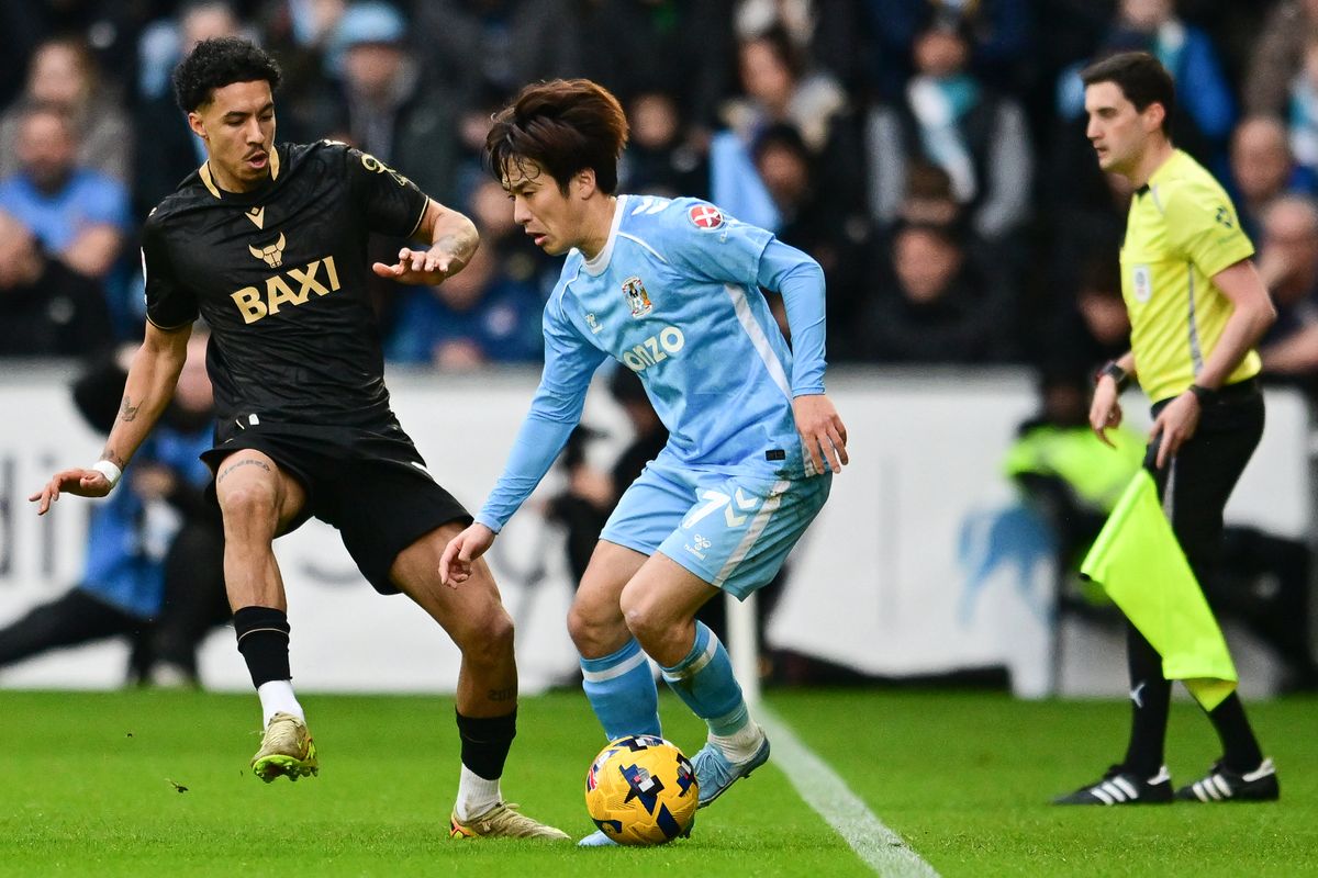 Coventry City midfielder Tatsuhiro Sakamoto (7)  under pressure from Oxford United defender Ruben Roosken