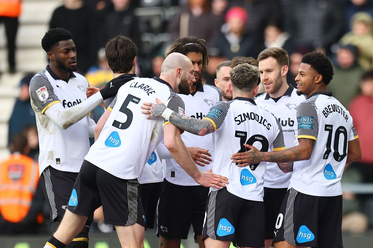 Rhian Brewster of Derby County celebrates scoring the opening goal against Swansea City with teammates