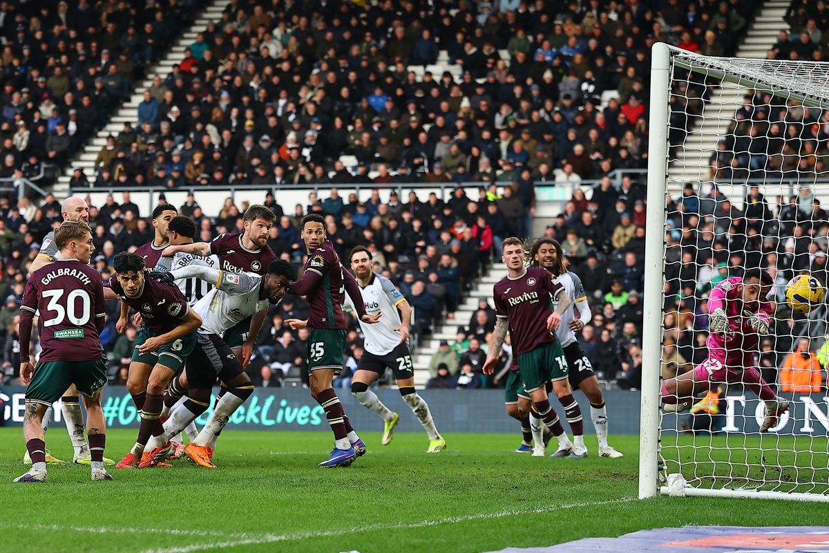 Patrick Agyemang of Derby County scores against Swansea City