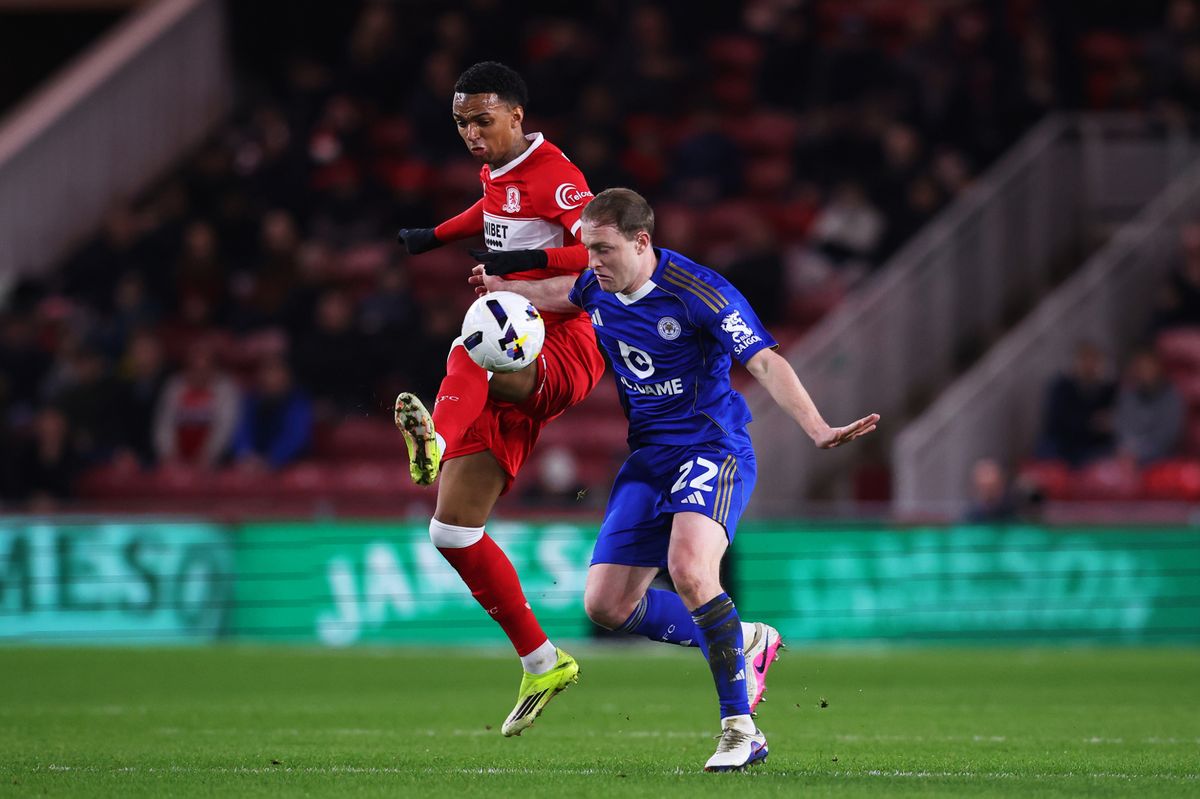 Morgan Whittaker of Middlesbrough battles for possession with Oliver Skipp 