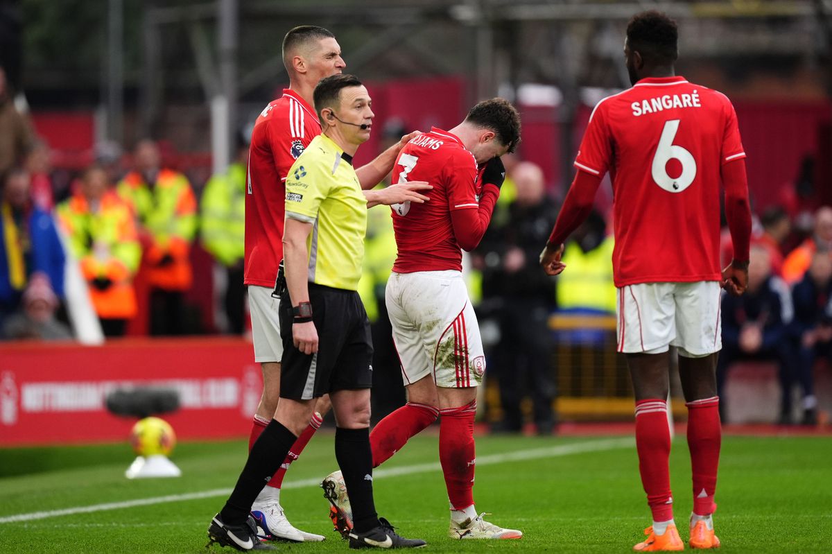 Nottingham Forest's Neco Williams leaves the field after being shown a red card for deliberate handball