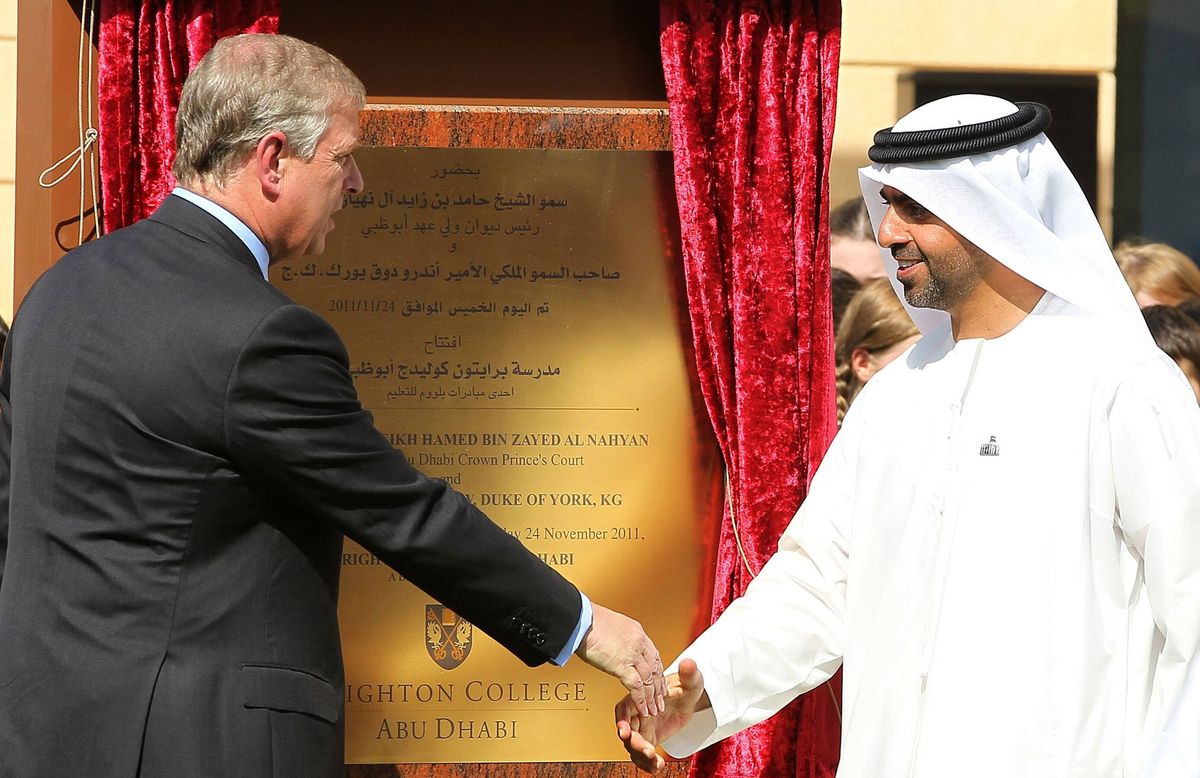 Prince Andrew (L), Duke of York, shakes