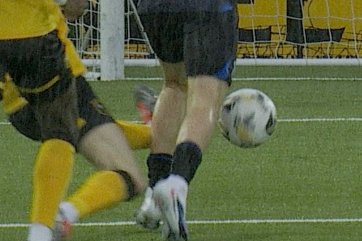 A close up angle of Cammy Kerr's challenge on Mikey Moore