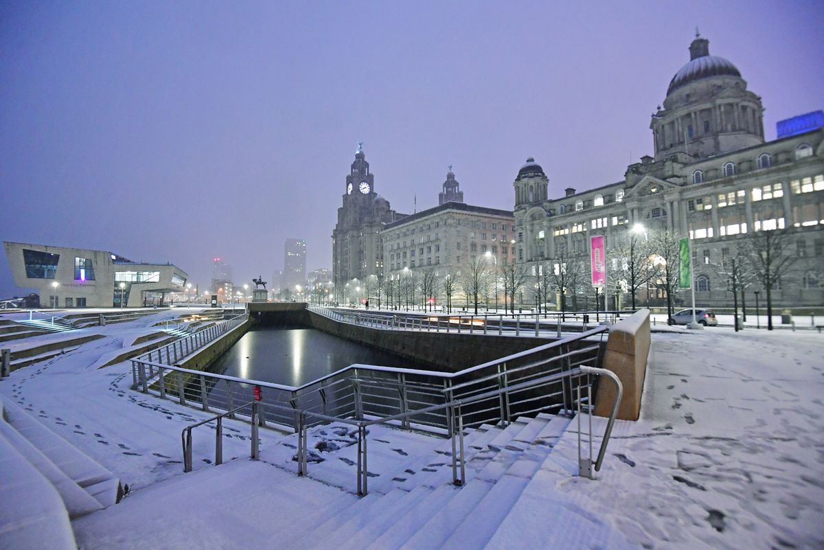 Snow falls on the Liverpool waterfront