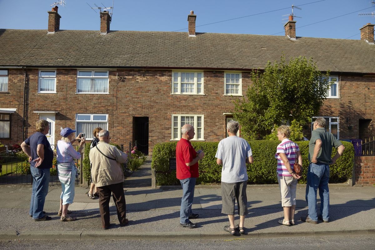 Visitors on a tour outside Forthlin Road