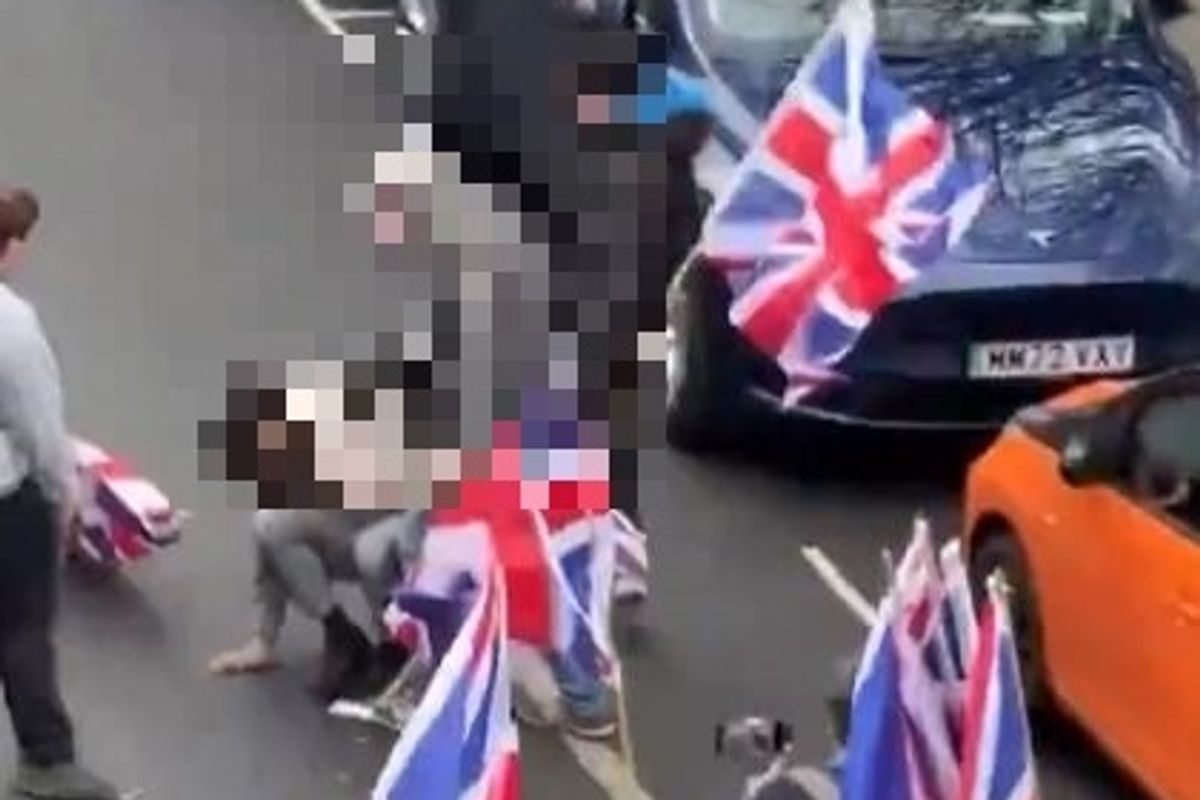 A screenshot from a video circulated online which appeared to show a male being attacked