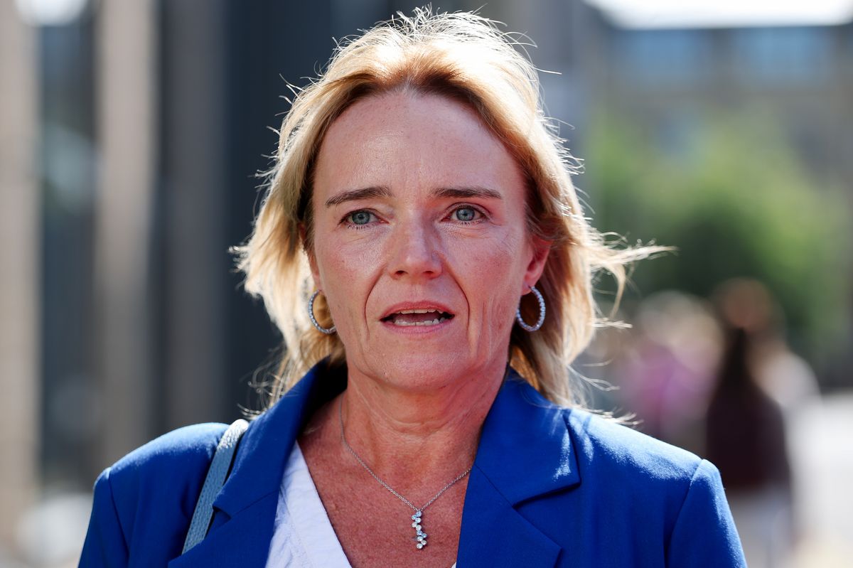 Sandie Peggie departs the tribunal wearing blue suit