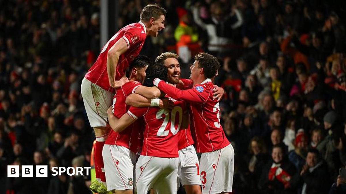 Wrexham players celebrate during their FA Cup third-round win over Nottingham Forest