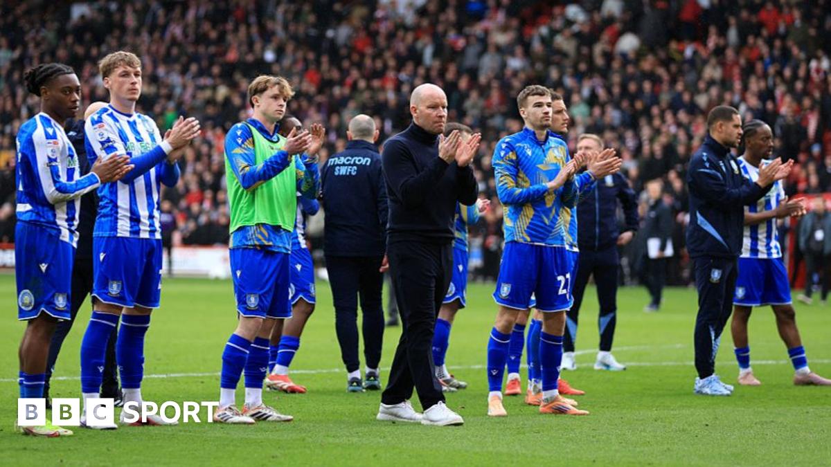 Sheffield Wednesday boss Henrik Pedersen (centre and his player) applaud the club's travelling support at Bramall Lane