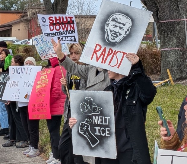 Many of the more than 1,000 people gathered Saturday, Jan. 31, 2026, at the intersection of East Colonial Avenue and Herndon Drive near Fashion Square Mall for the Ice Out of Orlando protest carried an assortment of signs, chanted and waved to passing motorists. (Brian Bell/Orlando Sentinel)