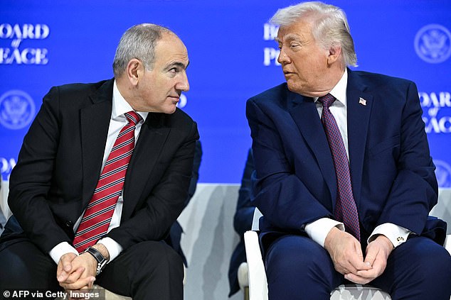 Armenia's Prime Minister Nikol Pashinyan (L) speaks with US President Donald Trump at the 'Board of Peace' meeting during the World Economic Forum (WEF) annual meeting in Davos on January 22, 2026