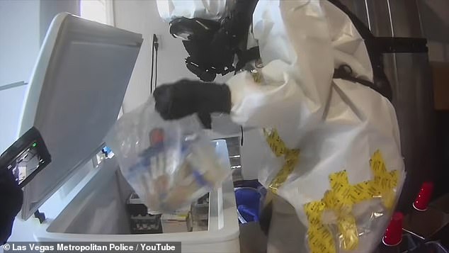 Pictured: Hazmat teams pulled bags of vials from a giant freezer