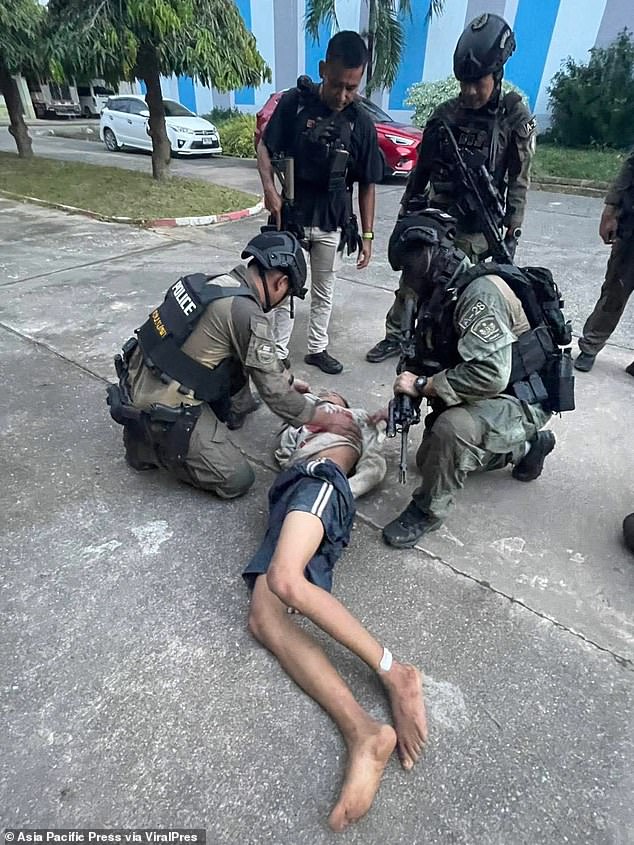 This is the dramatic moment a school shooter who opened fire with a machine gun was wrestled to the ground by police