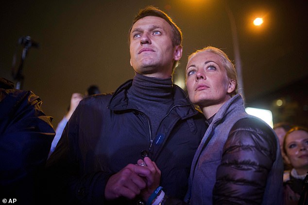 Navalny is pictured with his wife after a rally in Moscow, Russia, in September 2013