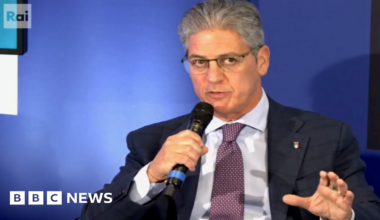 A man speaks into a microphone