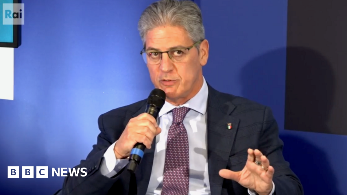 A man speaks into a microphone