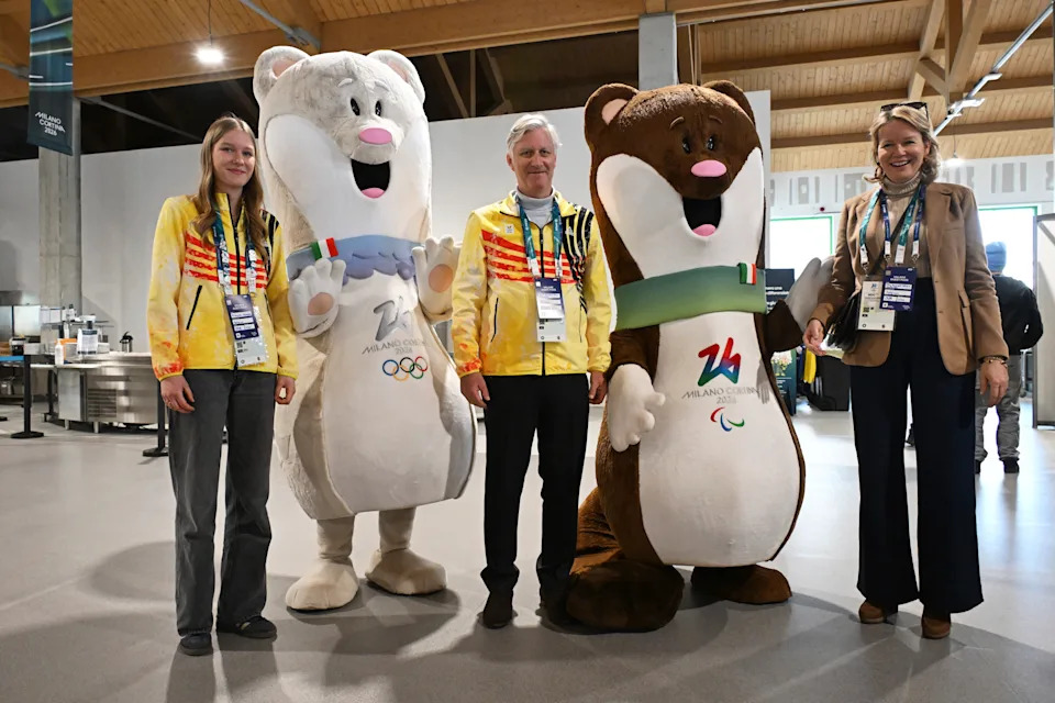 King Philippe of Belgium, Queen Mathilde and Princess Eleonore pose with mascots Tina, left, and Milo as they visit the Olympic Village during the 2026 Winter Olympics, in Milan, Italy, Saturday, Feb. 21, 2026. (Daniel Munoz/Pool Photo via AP)