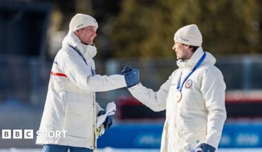 Sturla Holm Laegreid and Johan-Olav Botn shake hands on the podium