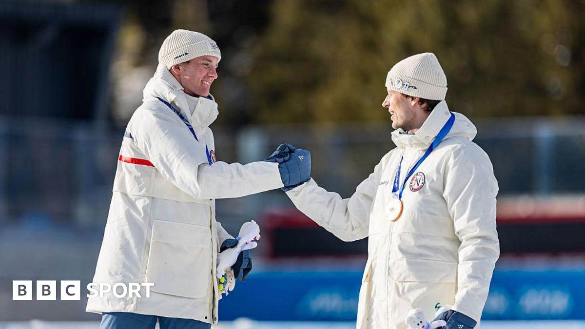 Sturla Holm Laegreid and Johan-Olav Botn shake hands on the podium