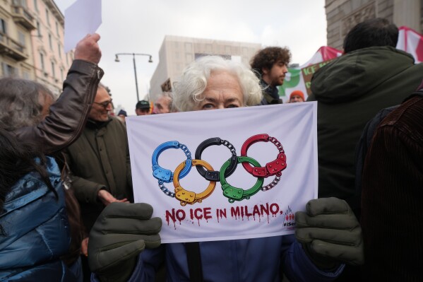 People take part in an Anti-ICE demonstration, ahead of the 2026 Winter Olympics, in Milan, Italy, Saturday, Jan. 31, 2026. (AP Photo/Antonio Calanni)